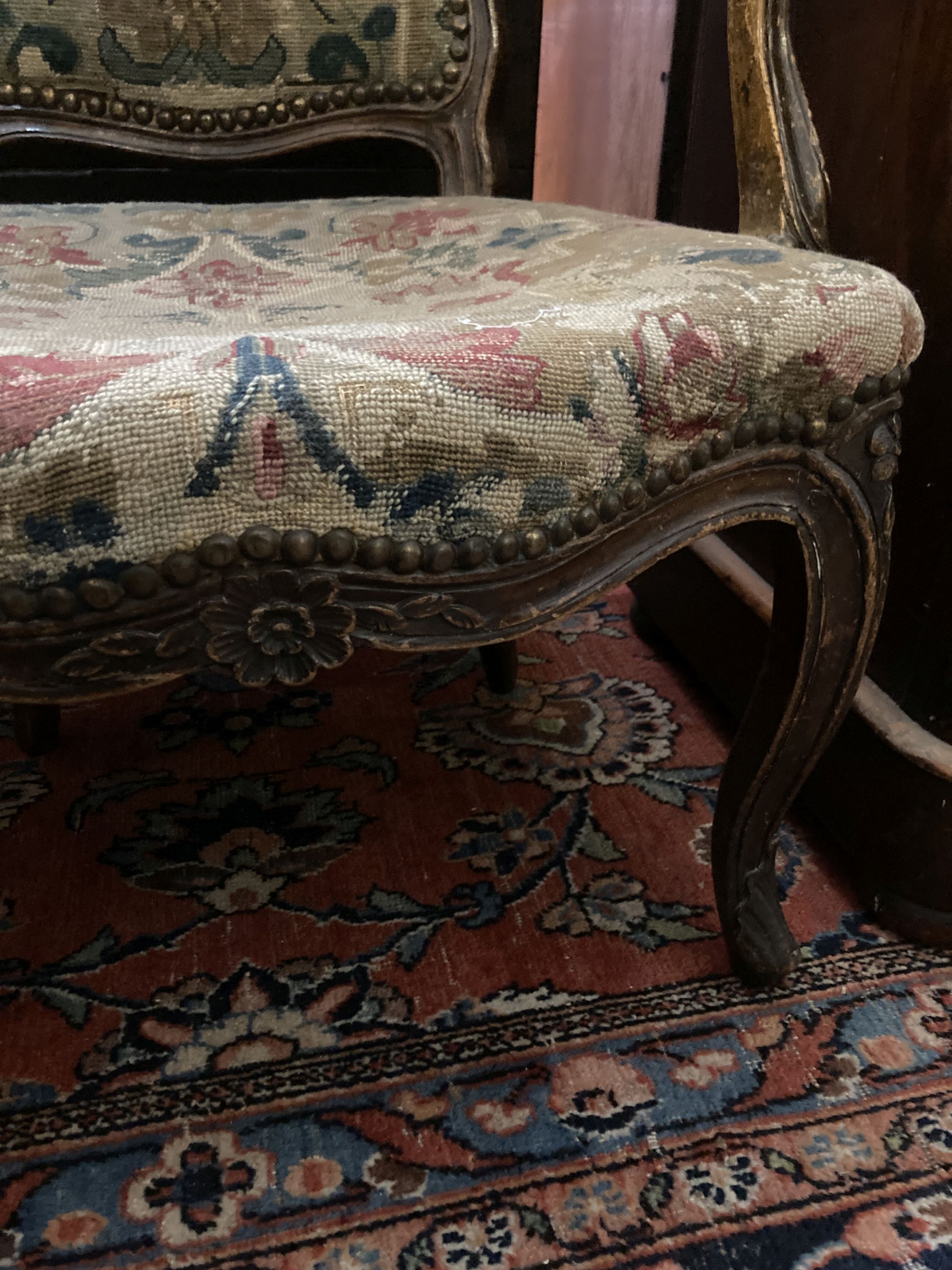 A Hepplewhite style mahogany armchair and a Louis XV walnut fauteuil covered in tapestry